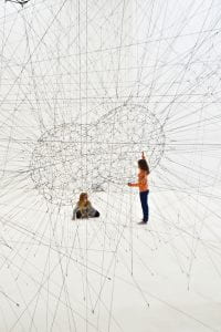 Two people inside a network of lines
