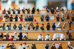 A range of Lego minifigures in rows like a stadium